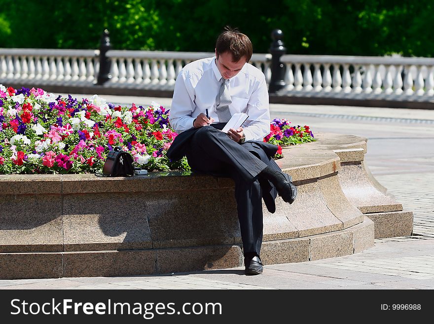 Successful young businessman working outdoor