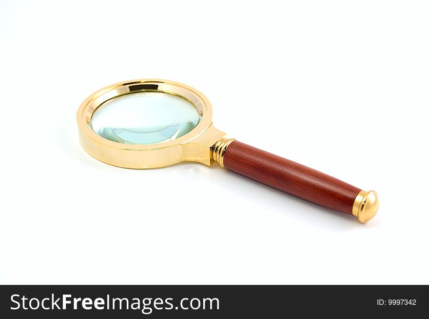 Magnifier with the wooden handle. Close-up. White background. Magnifier with the wooden handle. Close-up. White background.