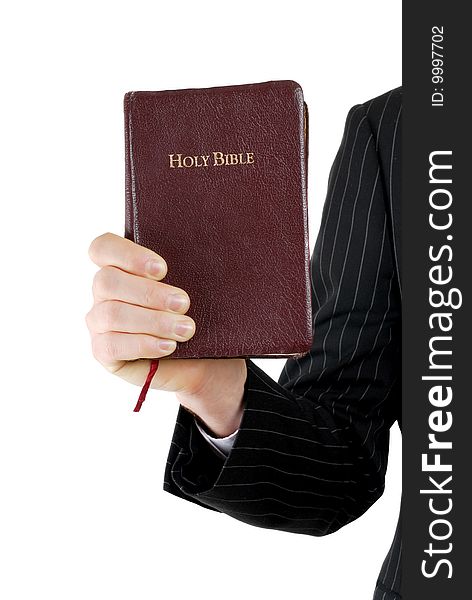 This is an image of a business man holding a bible.