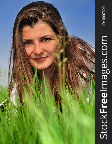 Girl with a fresh green grass. Girl with a fresh green grass