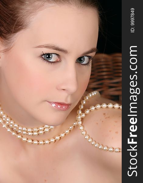 Close up of beautiful female wearing pearls. Close up of beautiful female wearing pearls