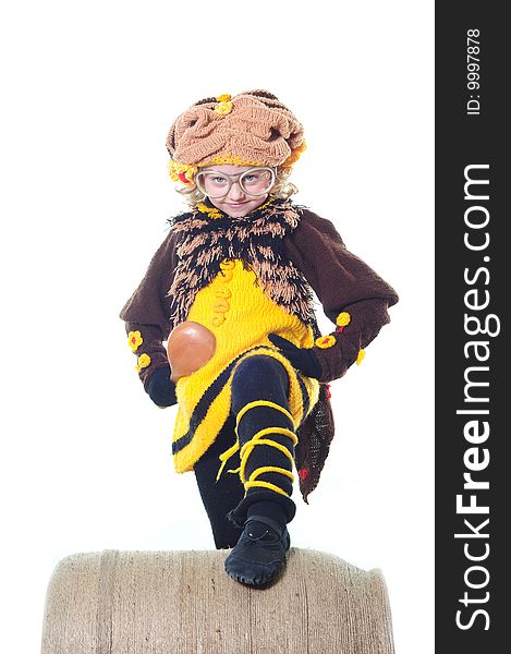 The little girl in a knitted suit of a bee or the cook
