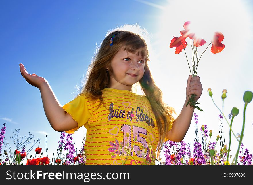 Little Girl Holding A Bunch Of  Poppy