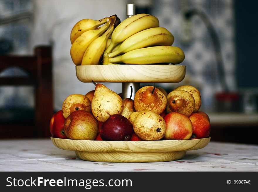 Close view of a bowl of mixed fruits, bananas, pears and apples. Close view of a bowl of mixed fruits, bananas, pears and apples.