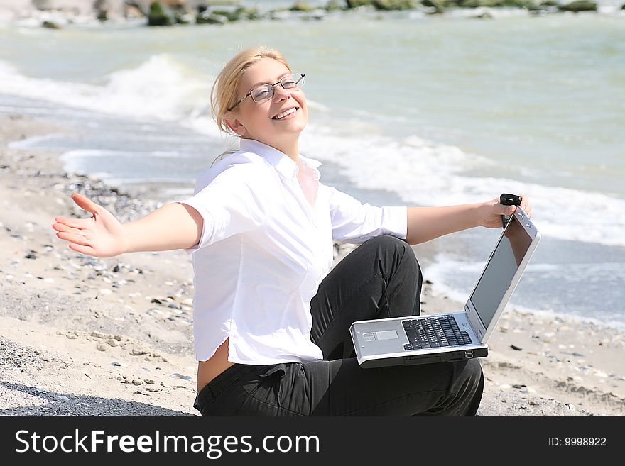 Businesswoman with business suit working on the beach. Businesswoman with business suit working on the beach