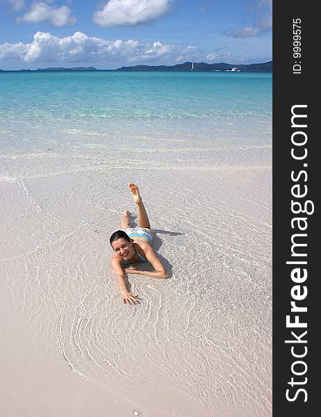 A girl enjoying the sun and water on Whitsundays island, Australia. A girl enjoying the sun and water on Whitsundays island, Australia.