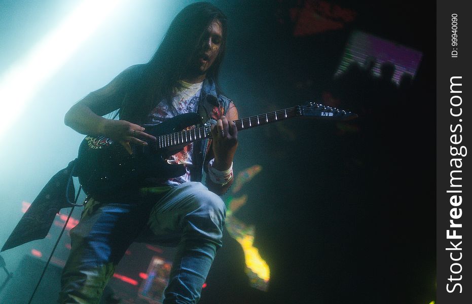 Musician Playing Guitar Onstage