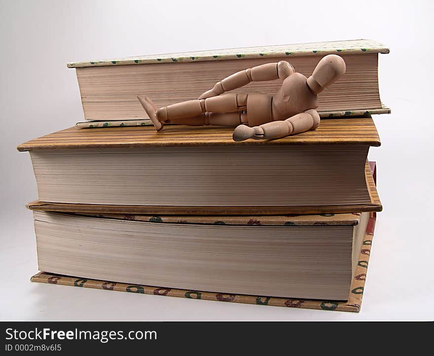 Photo of mannequin Laying on Books