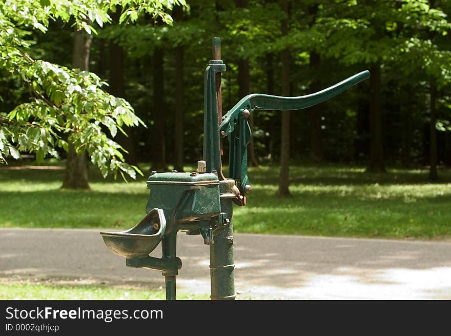 Old fashioned pump style water pump in a park in Northern Ohio. Old fashioned pump style water pump in a park in Northern Ohio.