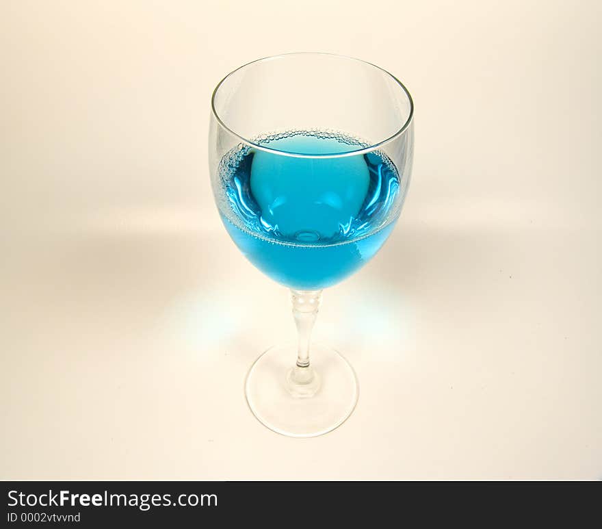 Photo of Wine Glass With Blue Liquid. Photo of Wine Glass With Blue Liquid