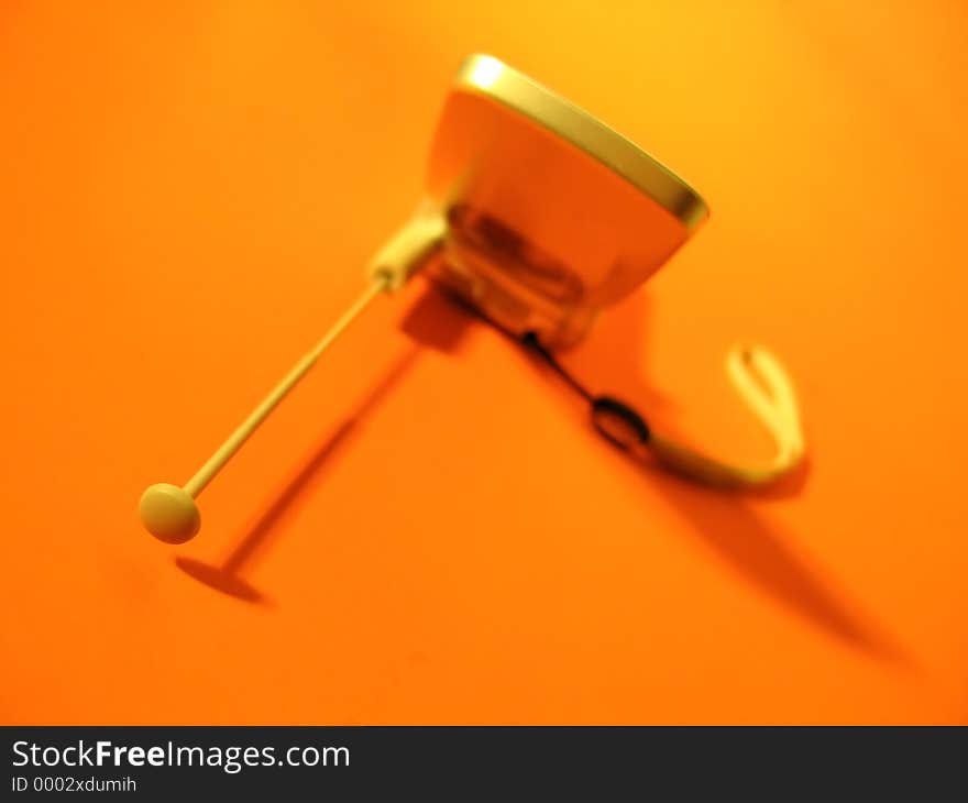 Cell phone on orange background, focus on the antenna. Cell phone on orange background, focus on the antenna.