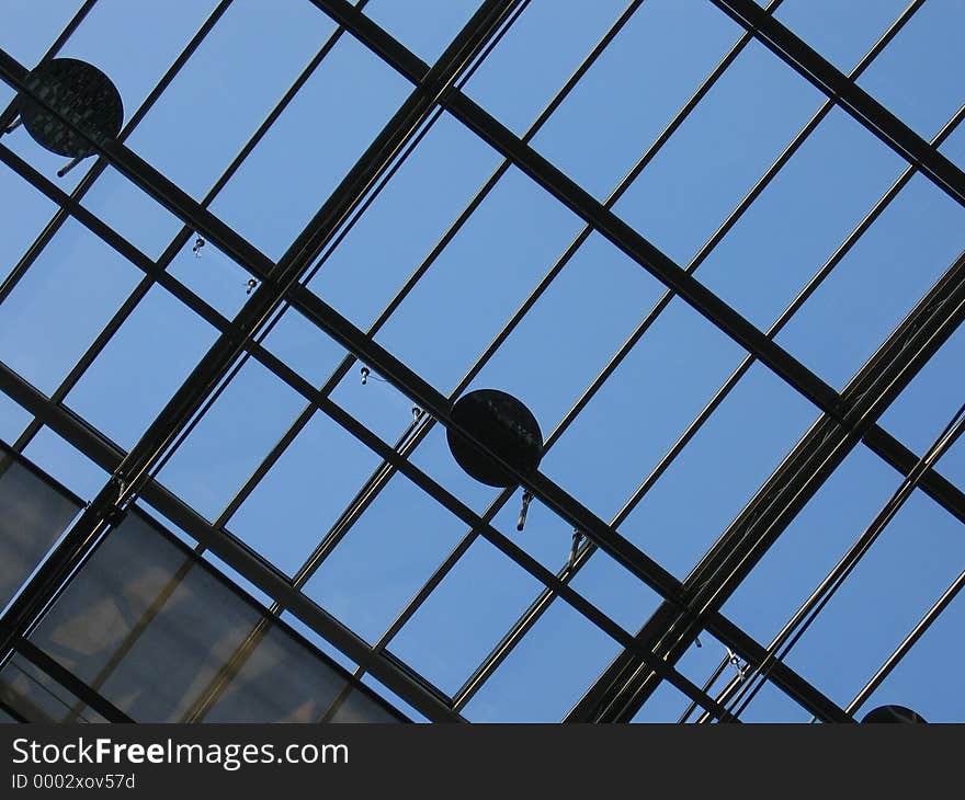 View up to a sky-light and a blue sky.