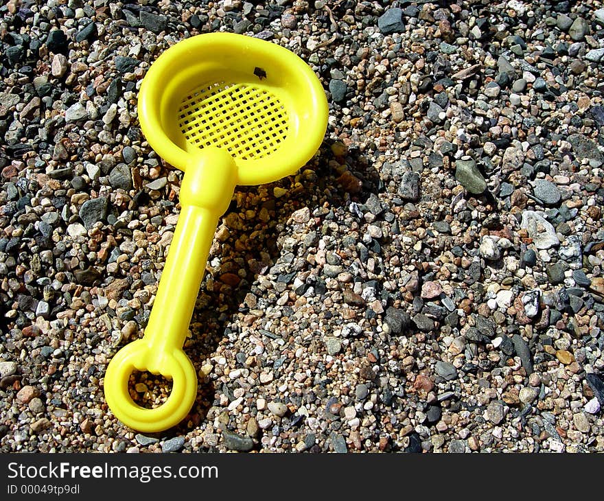 Yellow Sand Shovel on the beach