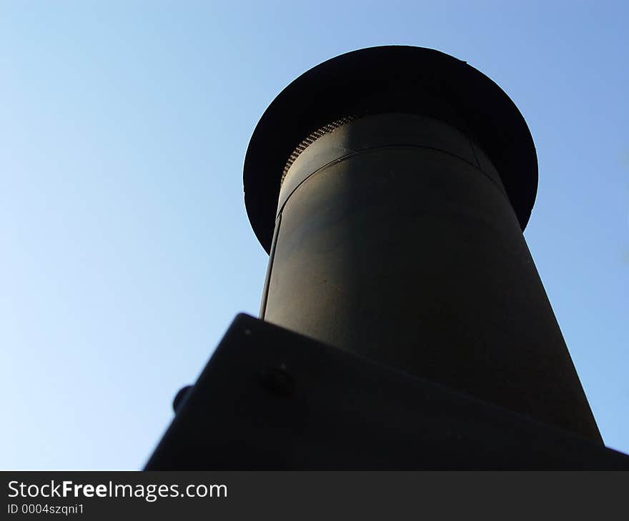 Looking upwards at a Chimmy with blue sky as the background