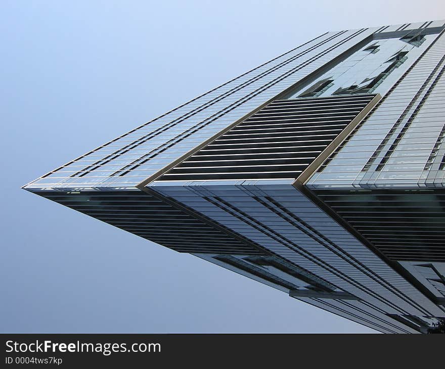 Corner of a modern glass building. Corner of a modern glass building.