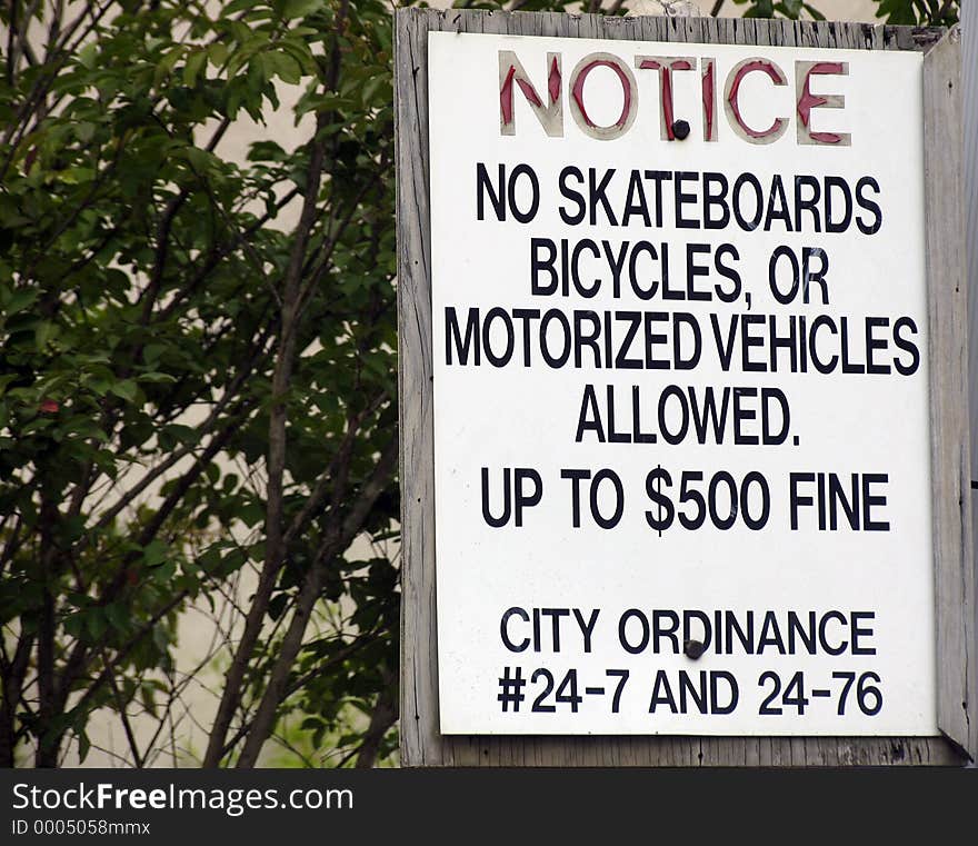 Sign which states no skateboards, bicycles or motorized vehicles. Sign which states no skateboards, bicycles or motorized vehicles