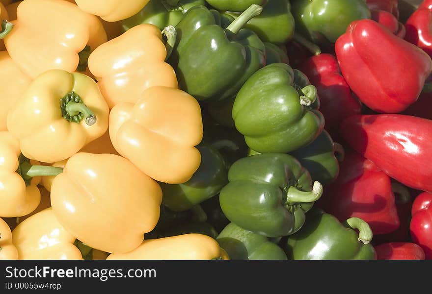 Multi-coloured display of peppers with very glossy and smooth skins. Multi-coloured display of peppers with very glossy and smooth skins