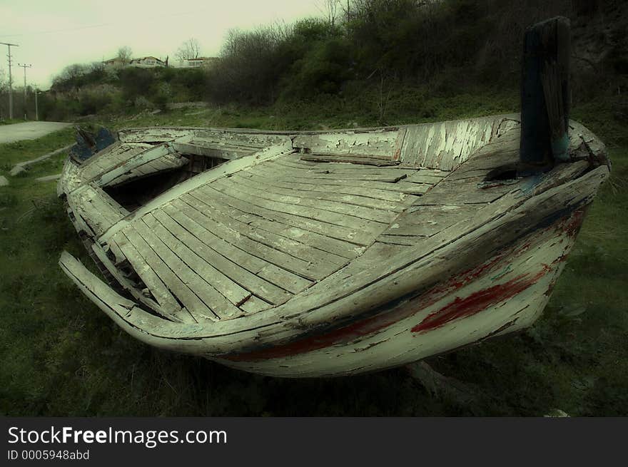 Ancient (retired) boat in Kiyikoy / Turkey. Soft focus version (dreamy atmosphere). Ancient (retired) boat in Kiyikoy / Turkey. Soft focus version (dreamy atmosphere).