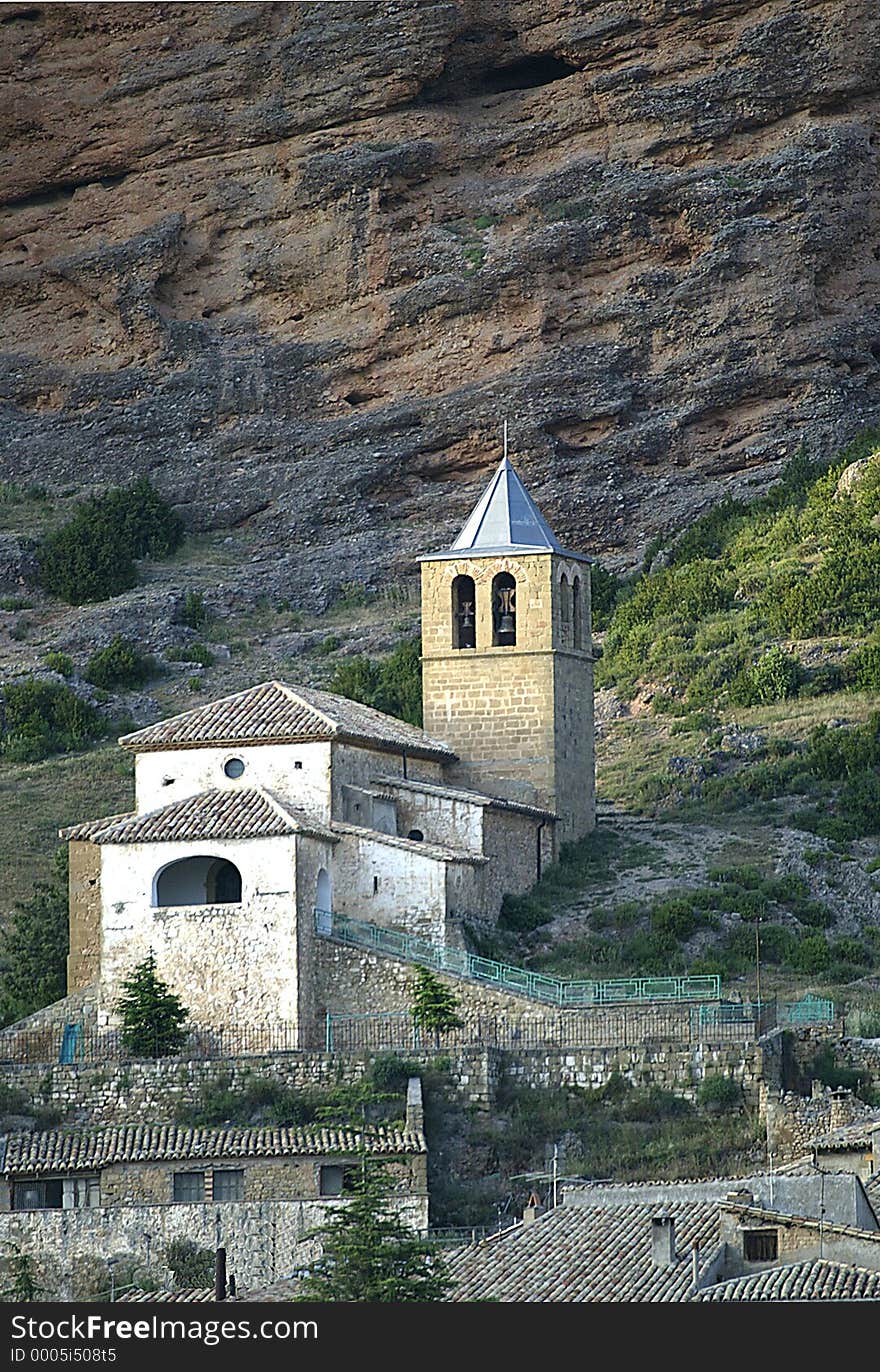 A romanesque church with the Mallos (Rocks) of Riglos behind. A romanesque church with the Mallos (Rocks) of Riglos behind.