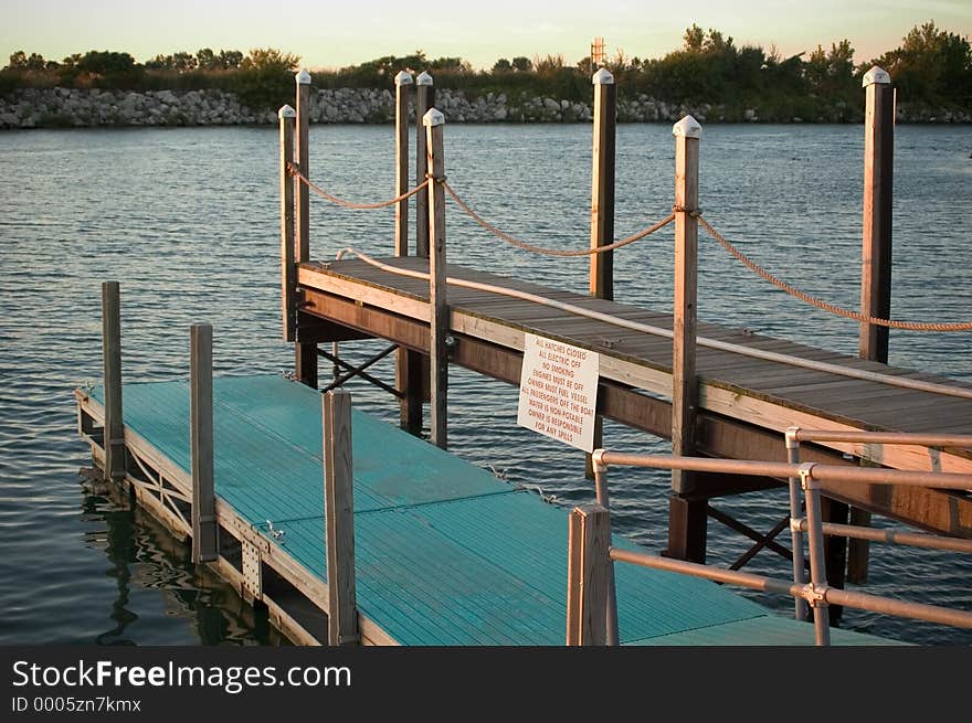 A 2 level dock area on Lake Erie with warning sign in view. Photographed in late evening sun. A 2 level dock area on Lake Erie with warning sign in view. Photographed in late evening sun