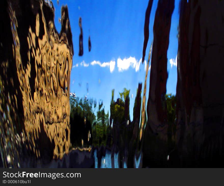 City scape defracted thru the falling water. City scape defracted thru the falling water