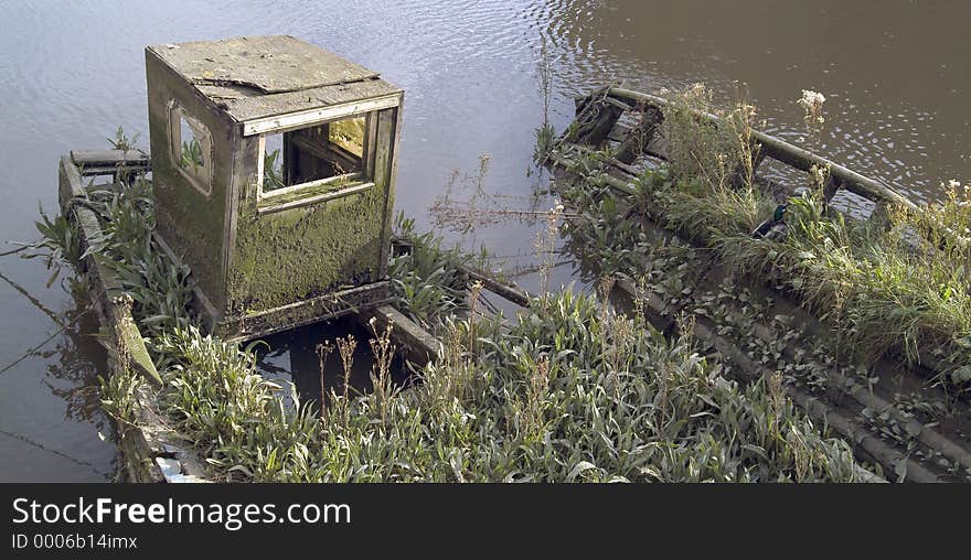 Remains of two inshore fishing boats, with vegetation growing from them, at Boston, Lincolnshire, England. A metaphor appropriate to the state of the fishing industry in Britain today, perhaps. Remains of two inshore fishing boats, with vegetation growing from them, at Boston, Lincolnshire, England. A metaphor appropriate to the state of the fishing industry in Britain today, perhaps.