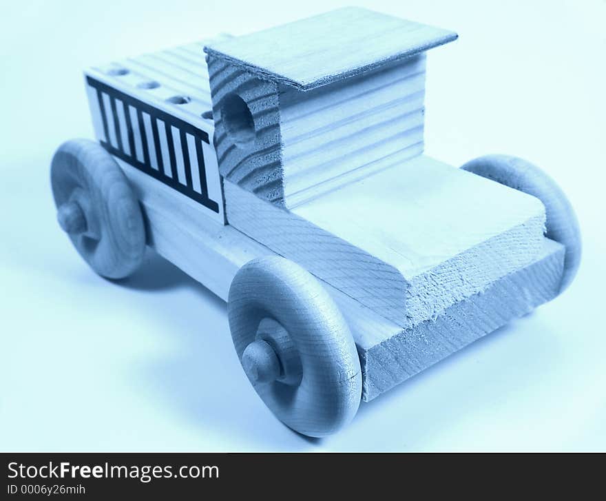 Photo of a Wooden Toy Truck In Cyan. Constructed From Scrap Wood and Store Bought Wheels. Photo of a Wooden Toy Truck In Cyan. Constructed From Scrap Wood and Store Bought Wheels.