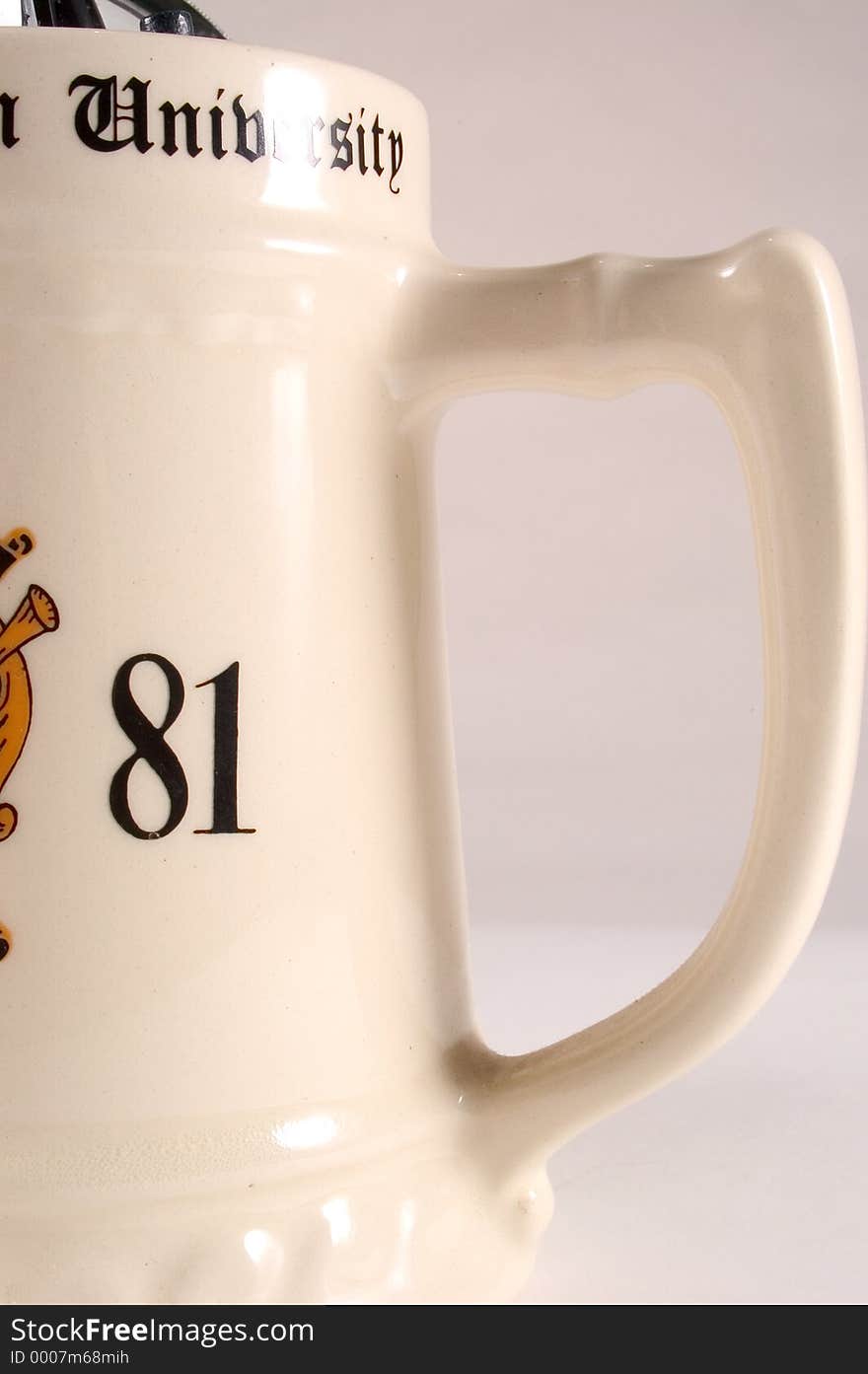 College Mug detail showing handle, part of the year and the word university. Mug is ceramic