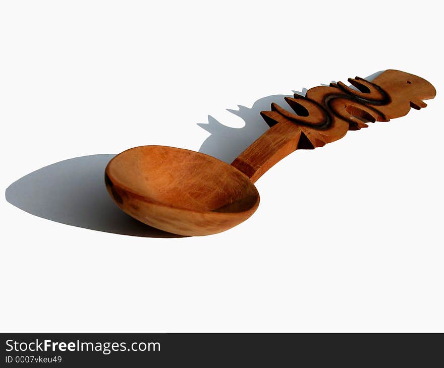 A handmade Romanian wooden spoon-isolation with shadow