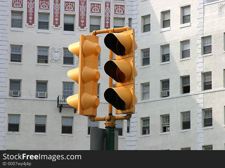 Traffic light with apartment in the back ground