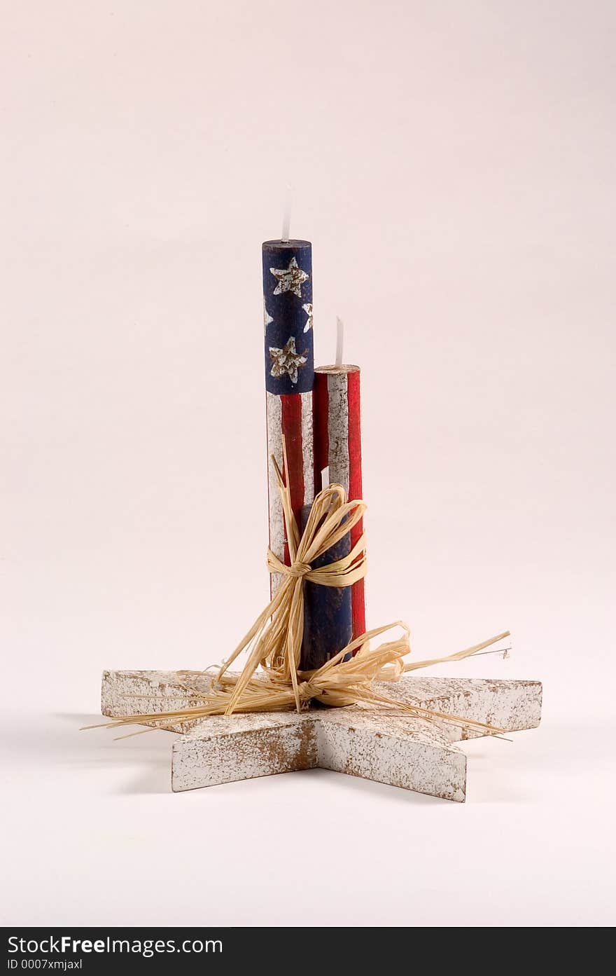 Wooden candles decorated with flag motif. wooden candles are mounted on a wooden star. Wooden candles decorated with flag motif. wooden candles are mounted on a wooden star