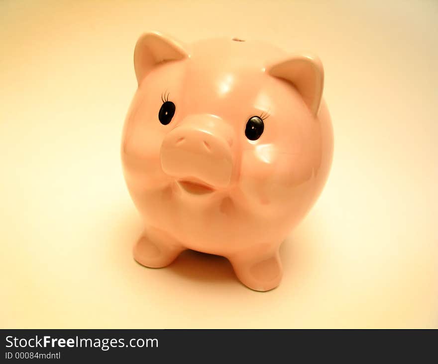 A cute pink piggy bank.