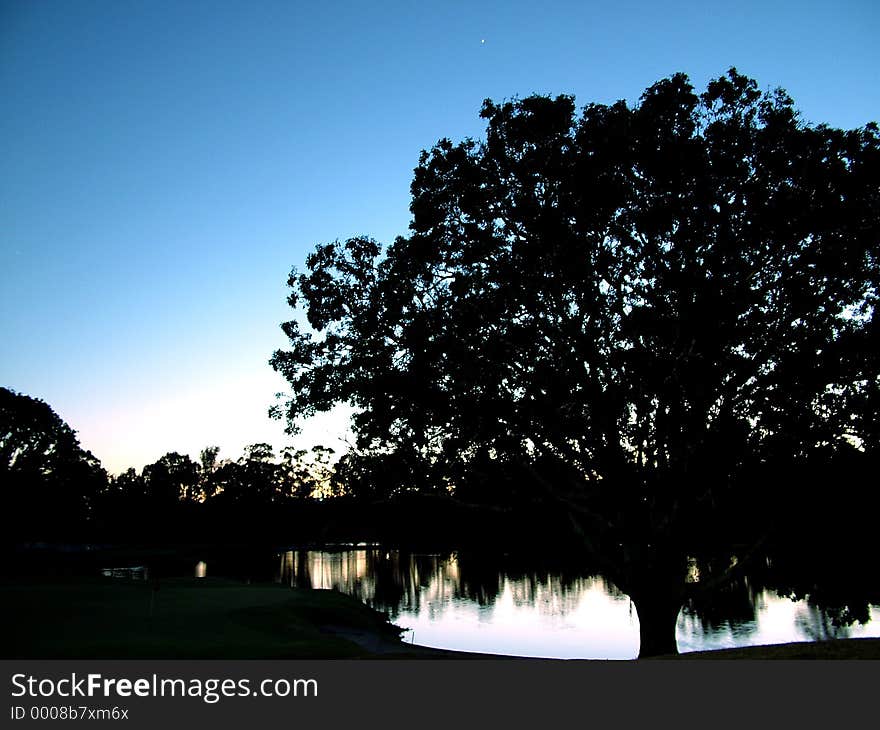 9th hole par 3 green on the left, sunrise over the lake, its a beautiful time of day. Maryborough, Queensland, Australia. 9th hole par 3 green on the left, sunrise over the lake, its a beautiful time of day. Maryborough, Queensland, Australia.