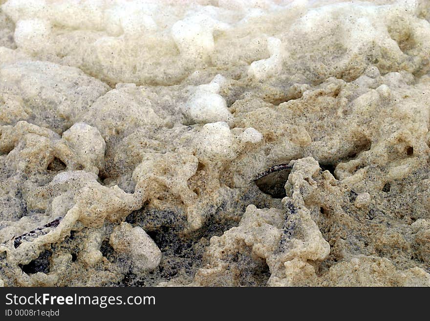 A close-up of dirty sea foam.