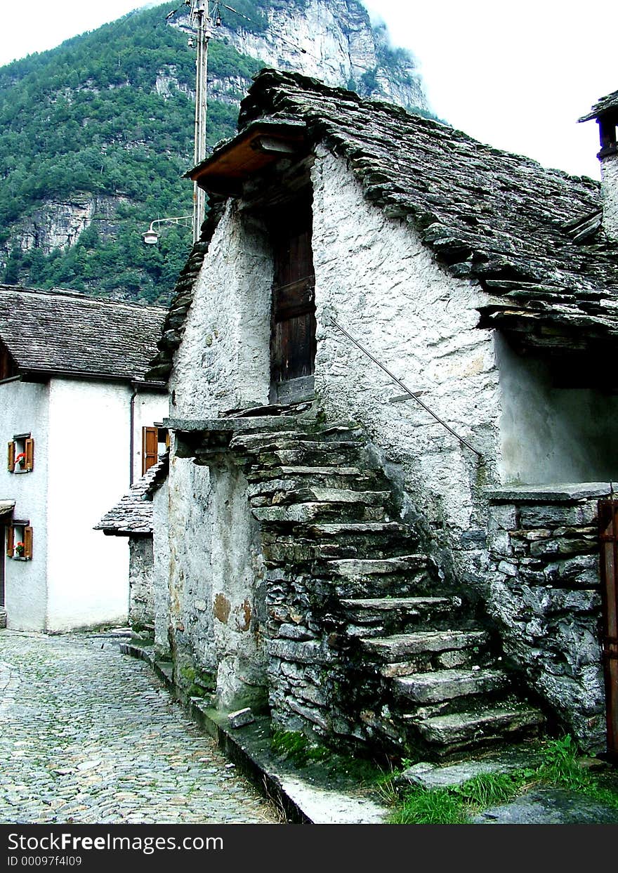 Digital photo of a house with a self-supporting stairway. It is typical for the verzasca-valley in switzerland. The houses are build out of stone and the roofs are build out of granite. Digital photo of a house with a self-supporting stairway. It is typical for the verzasca-valley in switzerland. The houses are build out of stone and the roofs are build out of granite.