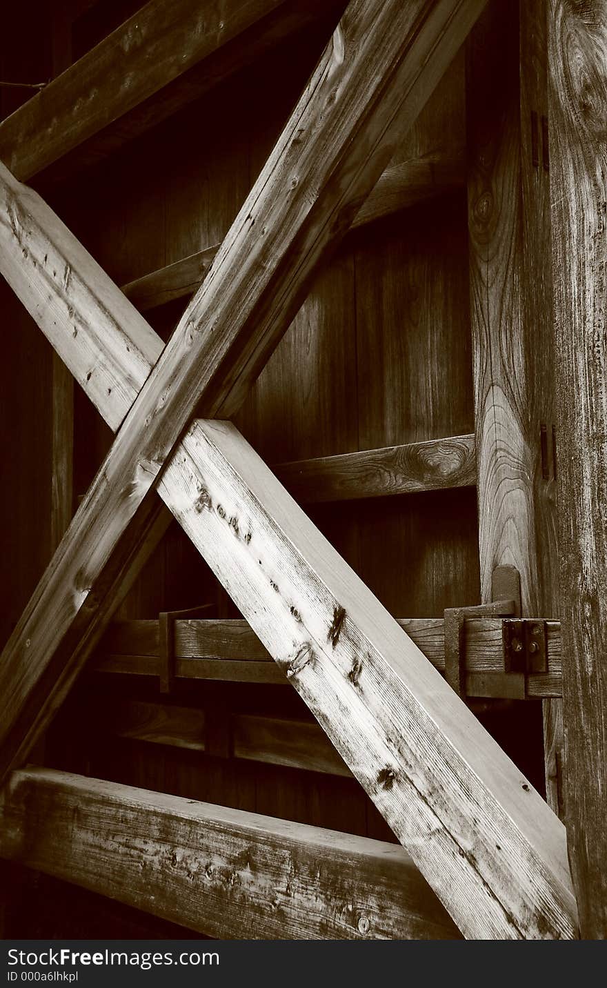 Large wooden temple gate in sepia.