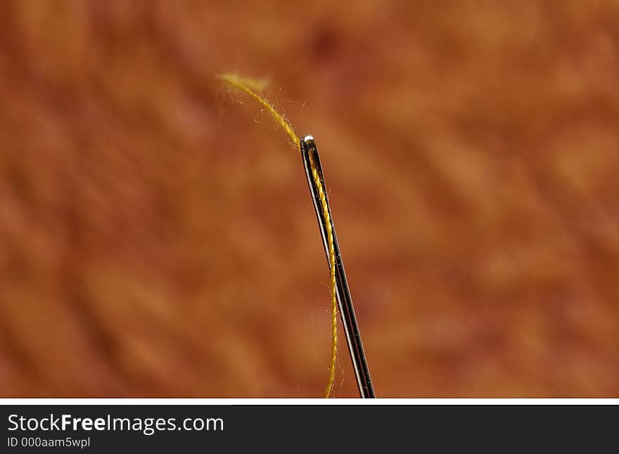 Macro Photo of a Threaded Needle. Macro Photo of a Threaded Needle