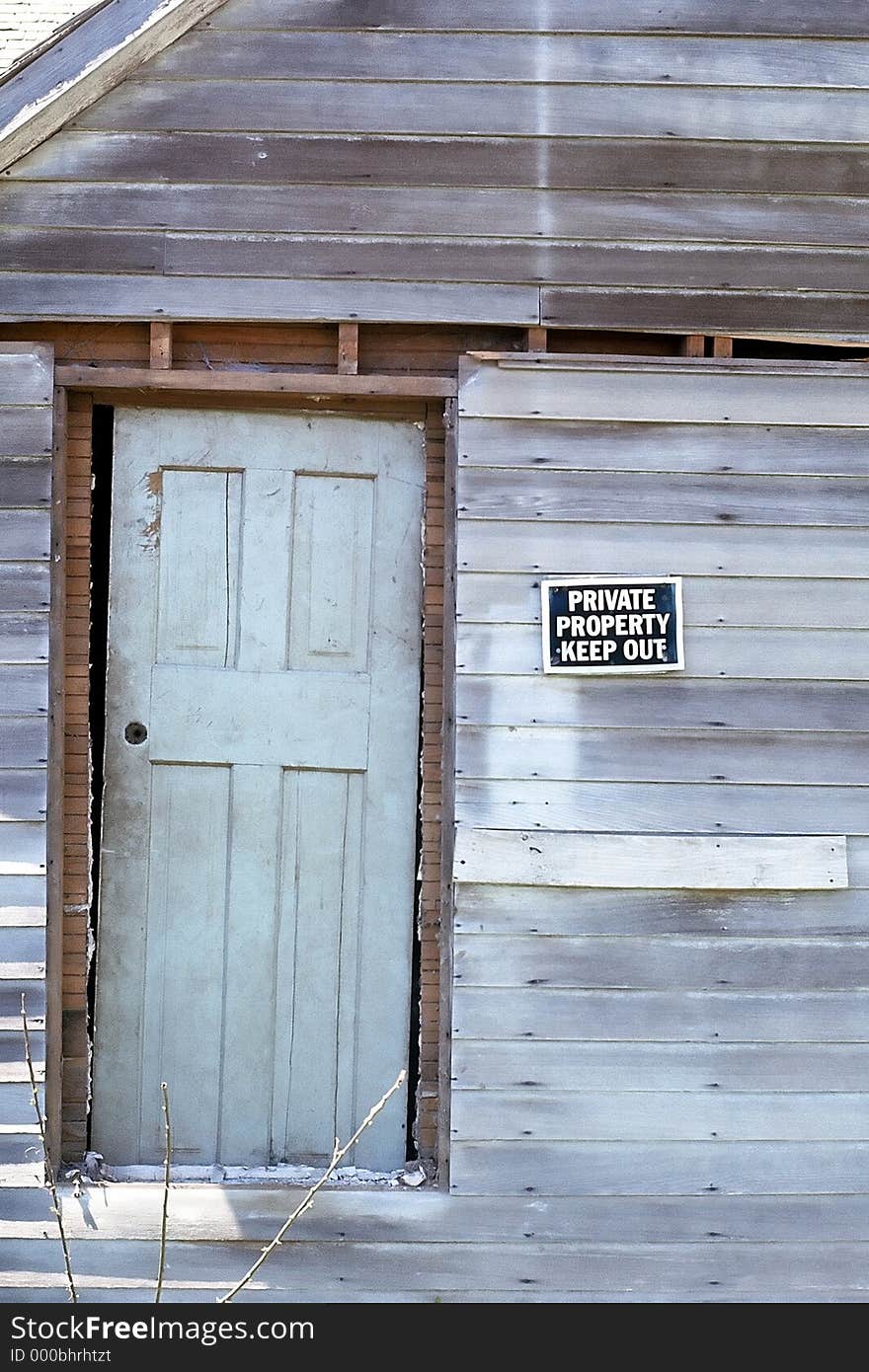 Sign posted on old, rundown house. Sign posted on old, rundown house.