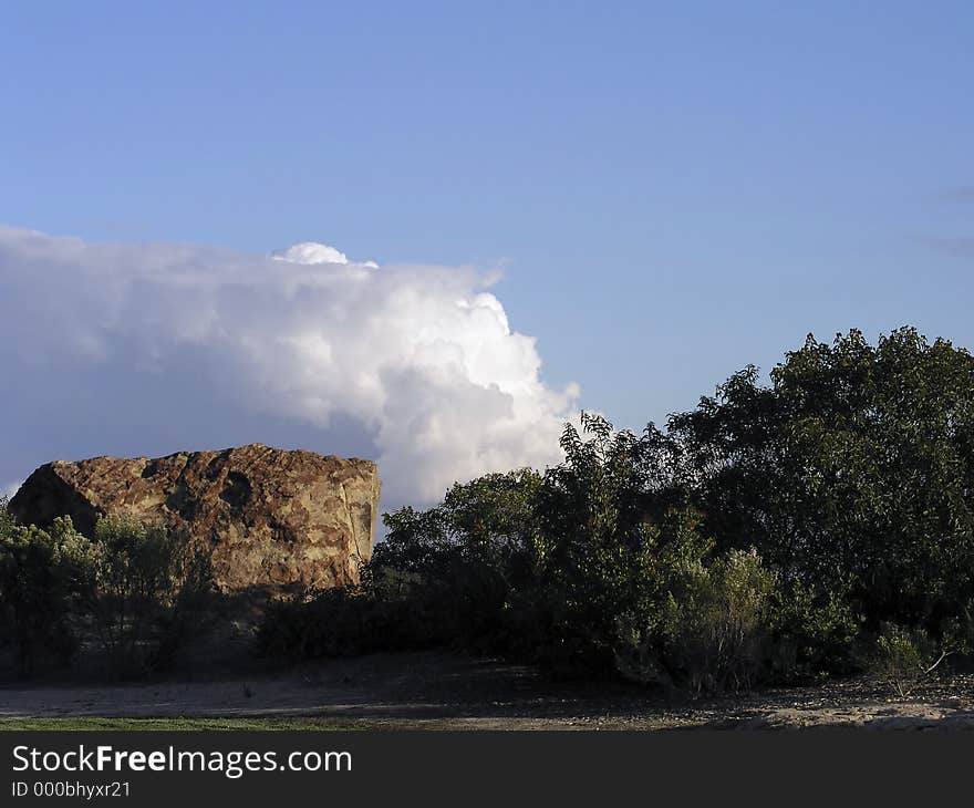 A study of a rock and a cloud pattern in Newport Beach. A study of a rock and a cloud pattern in Newport Beach