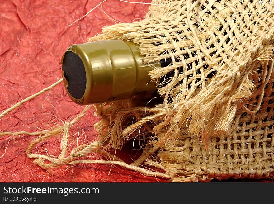 Photo of a Bottle in a Burlap Bag. Photo of a Bottle in a Burlap Bag