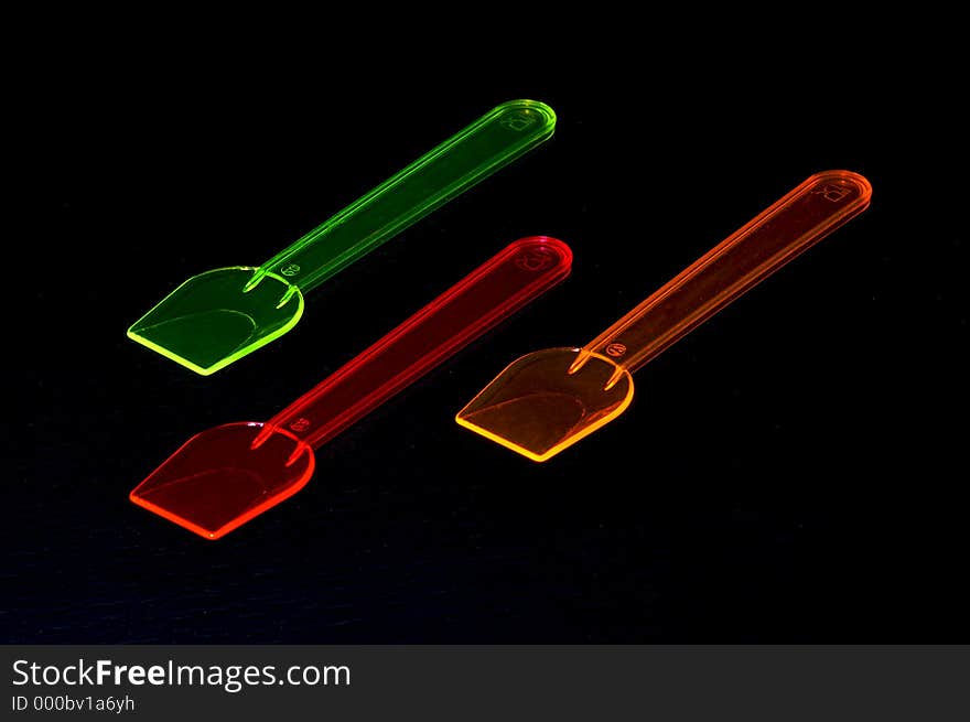 Three coloured spoons for ice cream. Three coloured spoons for ice cream