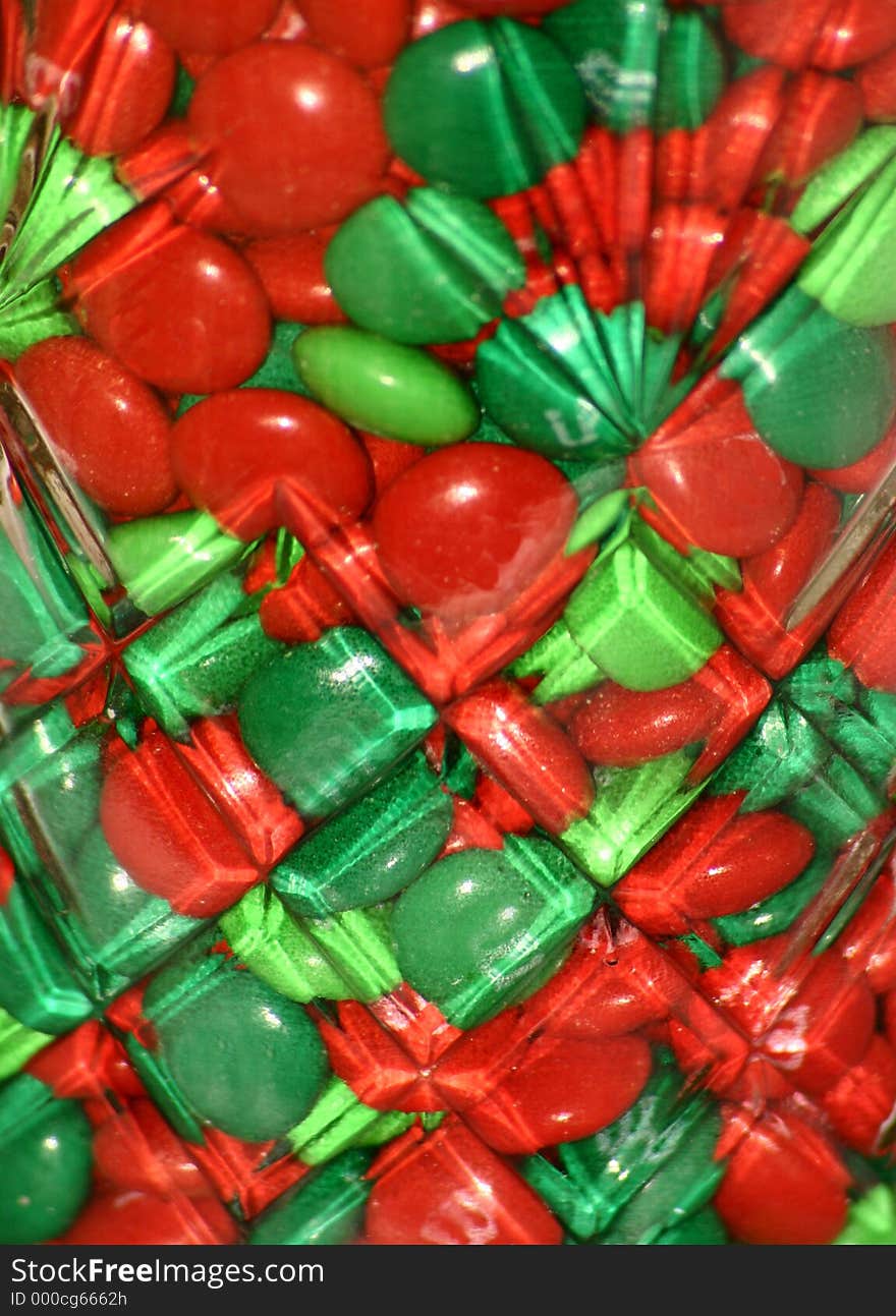 Green and Red candy close up in a decorative glass jar. Green and Red candy close up in a decorative glass jar