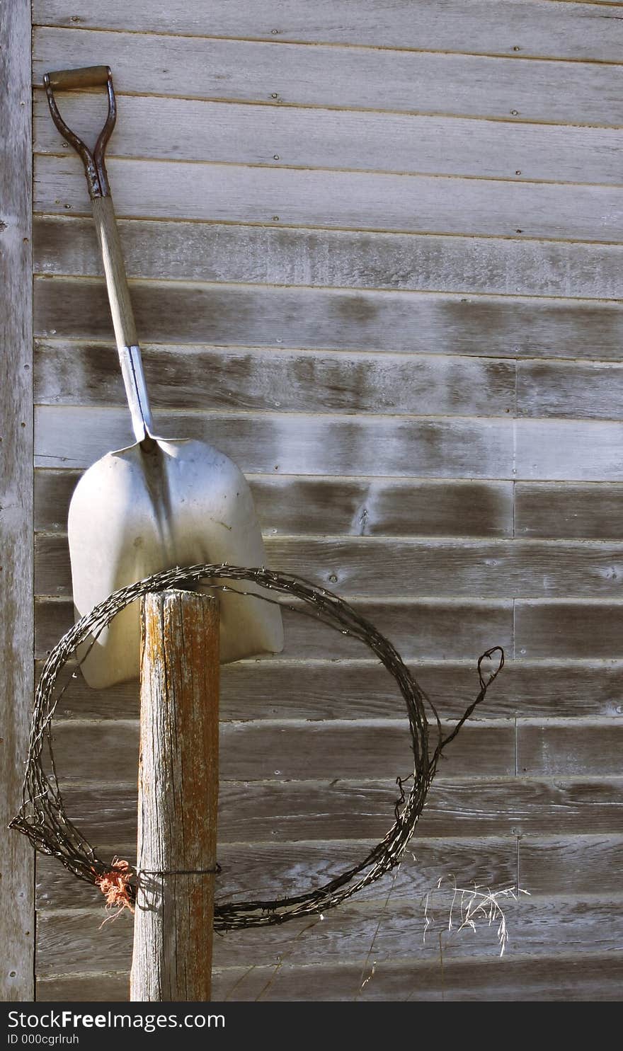 Tools propped on shed. Tools propped on shed