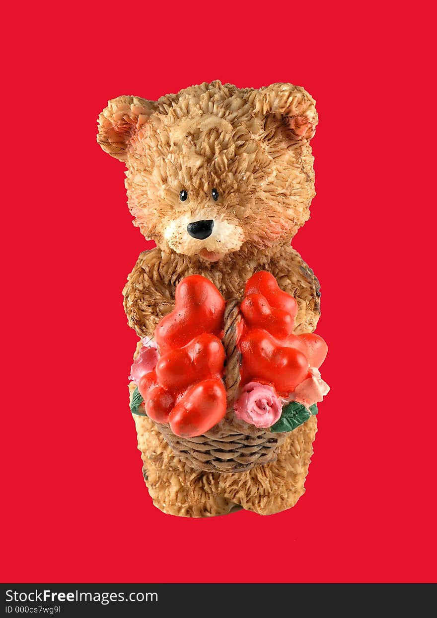 OLYMPUS DIGITAL CAMERA Close up of Valentine Day Bear cub figure with red background. OLYMPUS DIGITAL CAMERA Close up of Valentine Day Bear cub figure with red background