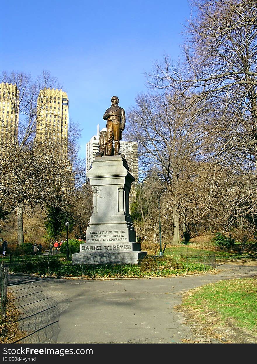 Tribute to Daniel Webster in Central Park of New York with skyscrapers in background. Tribute to Daniel Webster in Central Park of New York with skyscrapers in background