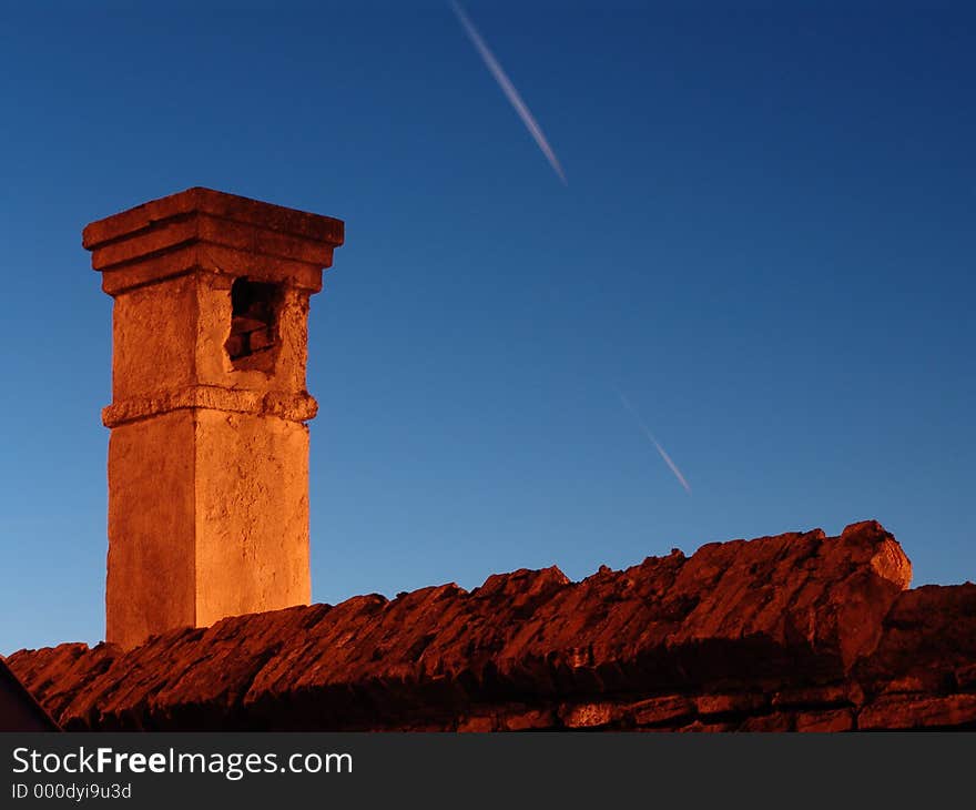 Old brick chimney in the night sky