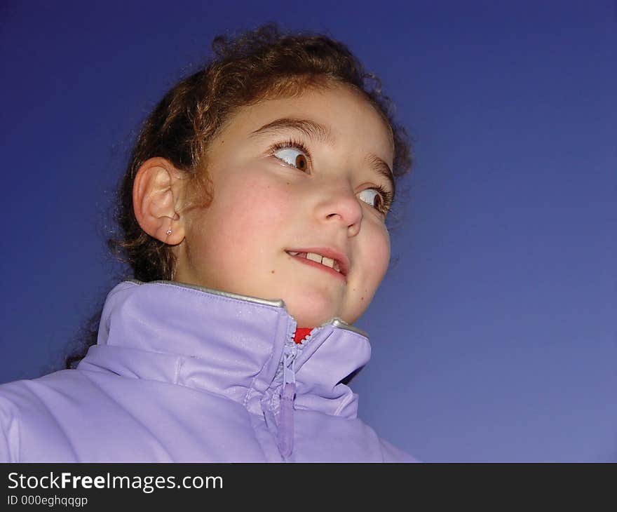 Cute girl against the sky