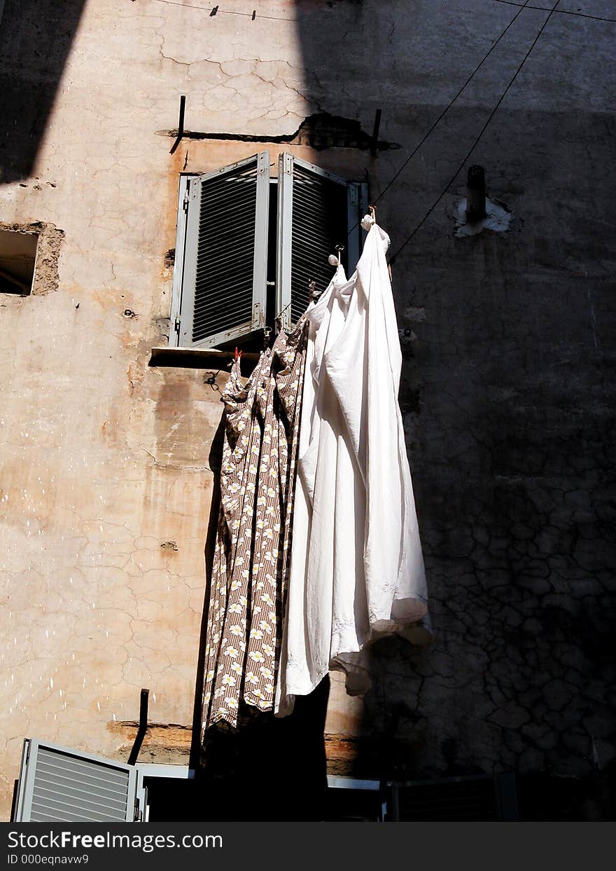 Washed sheets out of the window. Rome, Italy