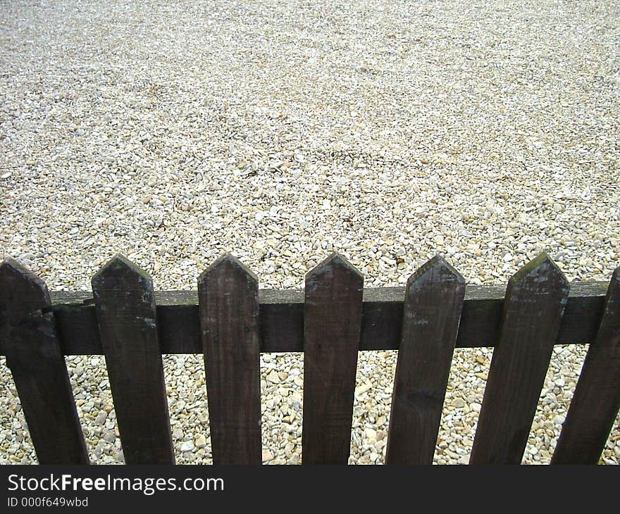 Wood fencing the stones. Wood fencing the stones