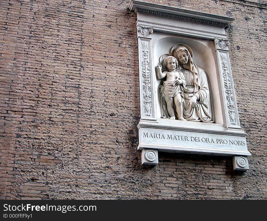 Statue of the Virgin and Jesus on a wall in Rome, Italy. Statue of the Virgin and Jesus on a wall in Rome, Italy